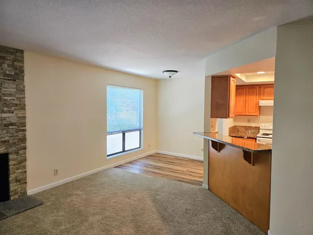 a view of a kitchen with a refrigerator and a stove