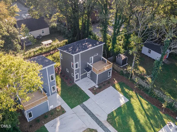 an aerial view of a house with a garden