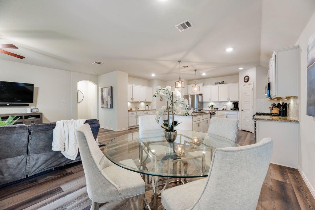 3404 Rio Grande Road Little Elm, TX 75068 - Photo 16 of 39 The kitchen flows seamlessly into the living and dining areas, creating a comfortable space for relaxing, entertaining, and everyday life.