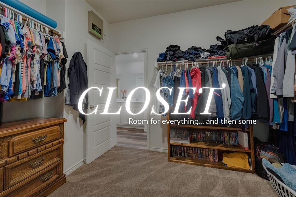 3404 Rio Grande Road Little Elm, TX 75068 - Photo 26 of 39 Spacious walk-in primary closet offering generous hanging space, shelving, and room for additional storage.