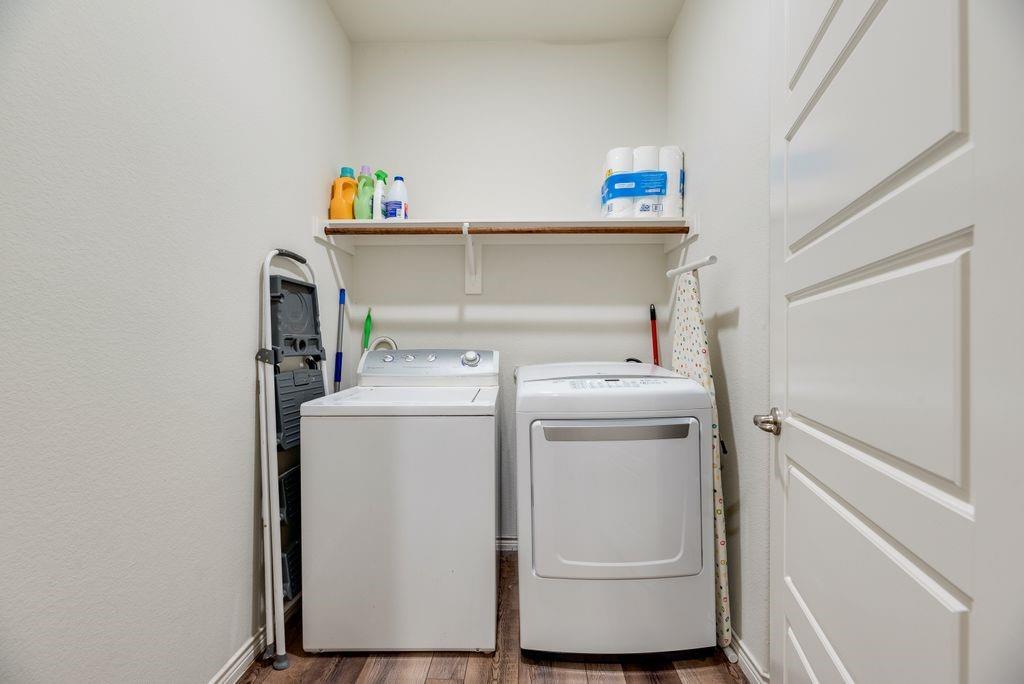 3404 Rio Grande Road Little Elm, TX 75068 - Photo 28 of 39 Convenient utility room with washer and dryer space, overhead storage shelving, and additional linen closet located behind the door.