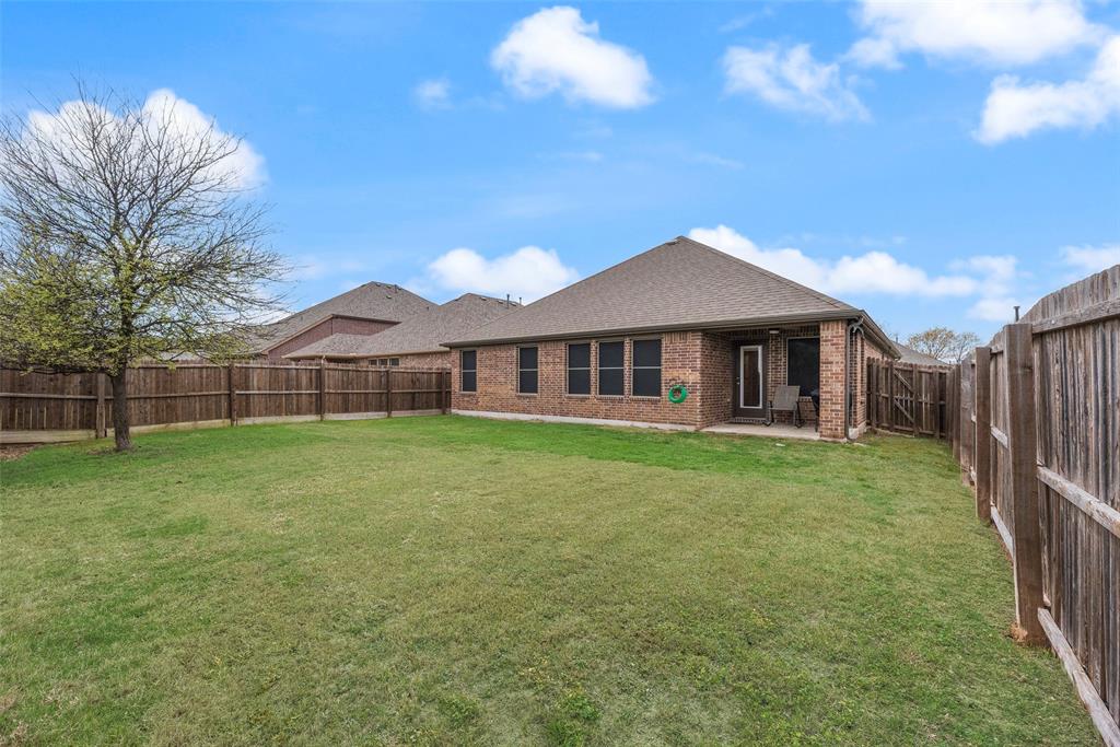 3404 Rio Grande Road Little Elm, TX 75068 - Photo 32 of 39 Spacious fenced backyard offering plenty of room for outdoor activities, gardening, play, or creating your own backyard retreat.