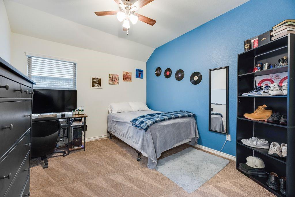 3404 Rio Grande Road Little Elm, TX 75068 - Photo 6 of 39 Well-sized secondary bedroom with natural light, plush carpeting, and flexible space for guests, a home office, or hobbies.