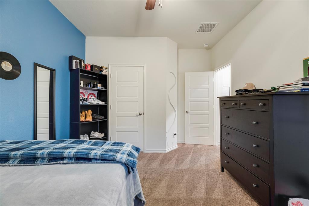 3404 Rio Grande Road Little Elm, TX 75068 - Photo 7 of 39 Comfortable secondary bedroom with great natural light and plenty of space for a bedroom, office, or creative space.