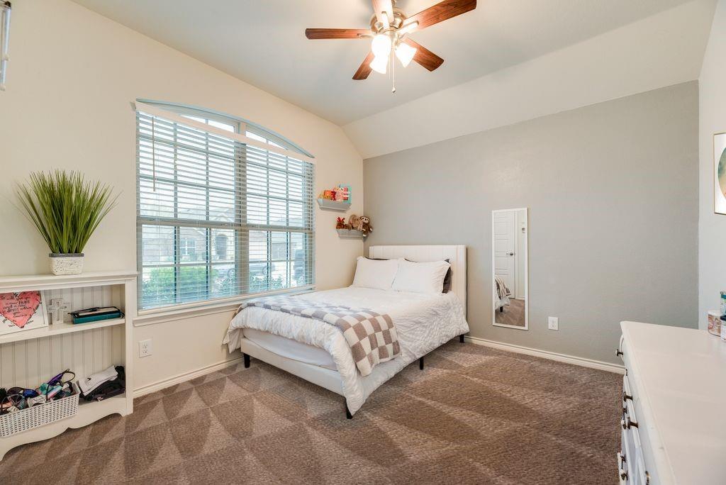3404 Rio Grande Road Little Elm, TX 75068 - Photo 9 of 39 Bright and spacious secondary bedroom featuring a large window for natural light