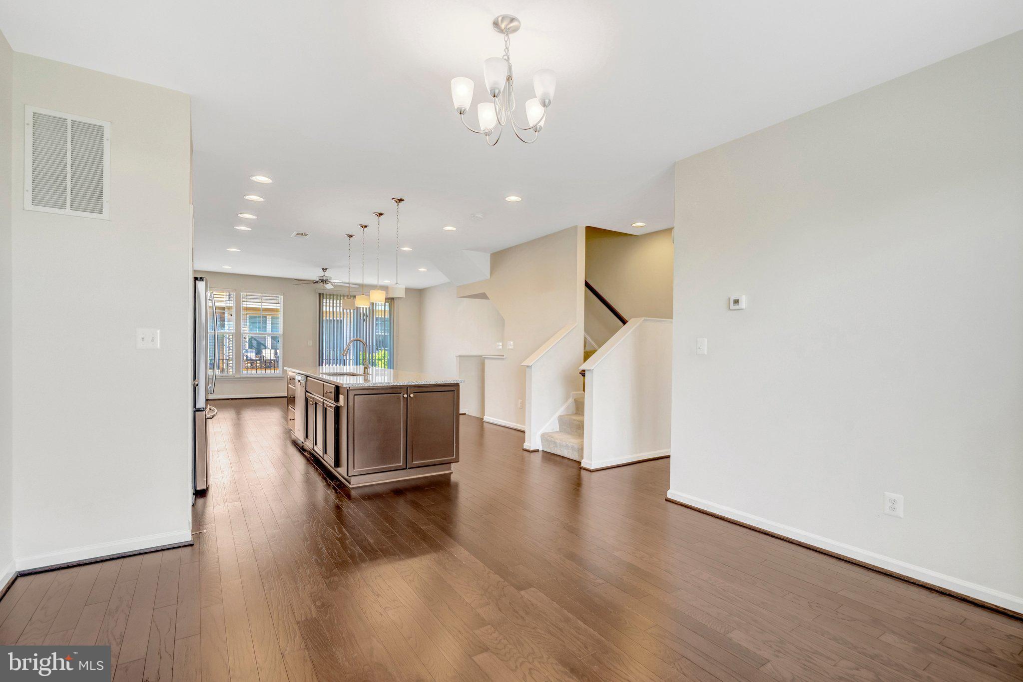 8932 Dahlgren Ridge Road Manassas, VA 20111 - Photo 16 of 41 a living room with furniture and a wooden floor