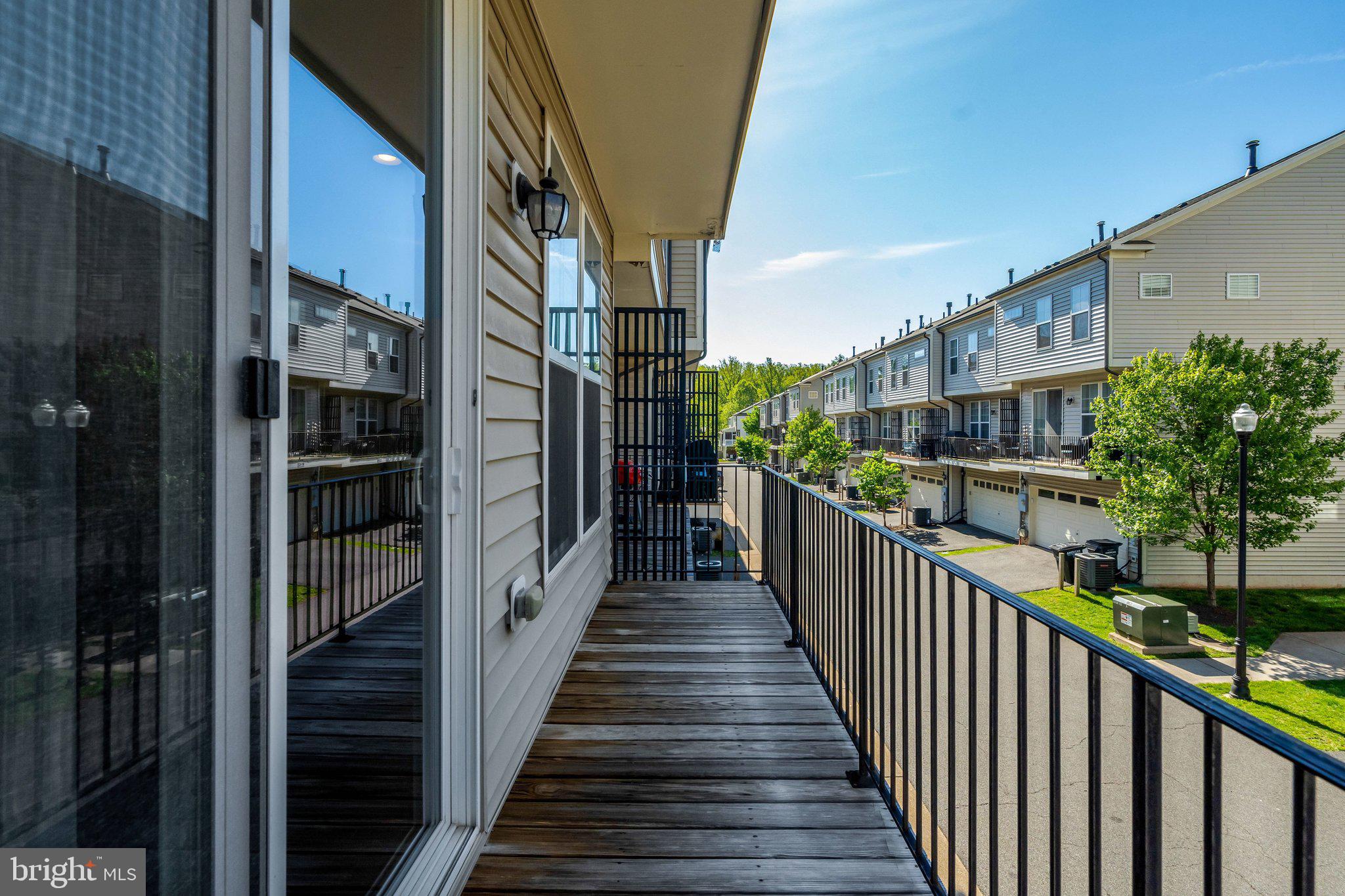 8932 Dahlgren Ridge Road Manassas, VA 20111 - Photo 20 of 41 a view of a balcony with wooden stairs