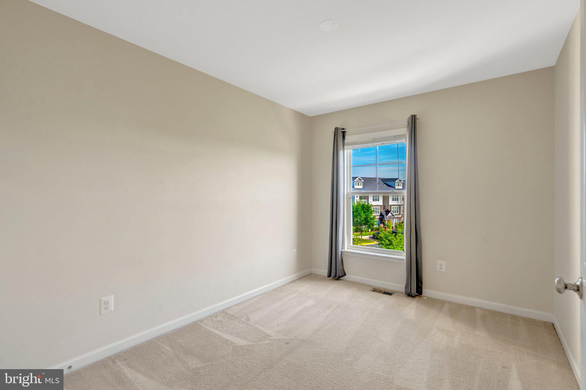 8932 Dahlgren Ridge Road Manassas, VA 20111 - Photo 29 of 41 a view of an empty room with a window