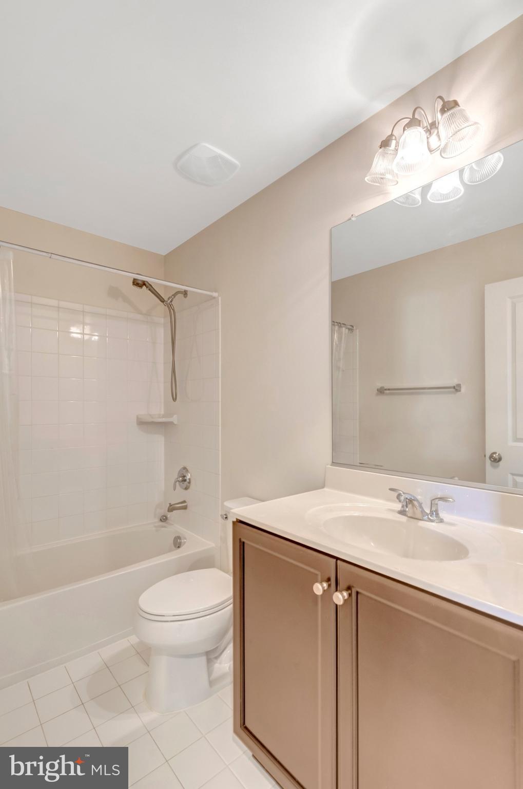 8932 Dahlgren Ridge Road Manassas, VA 20111 - Photo 34 of 41 a bathroom with a sink a toilet and shower