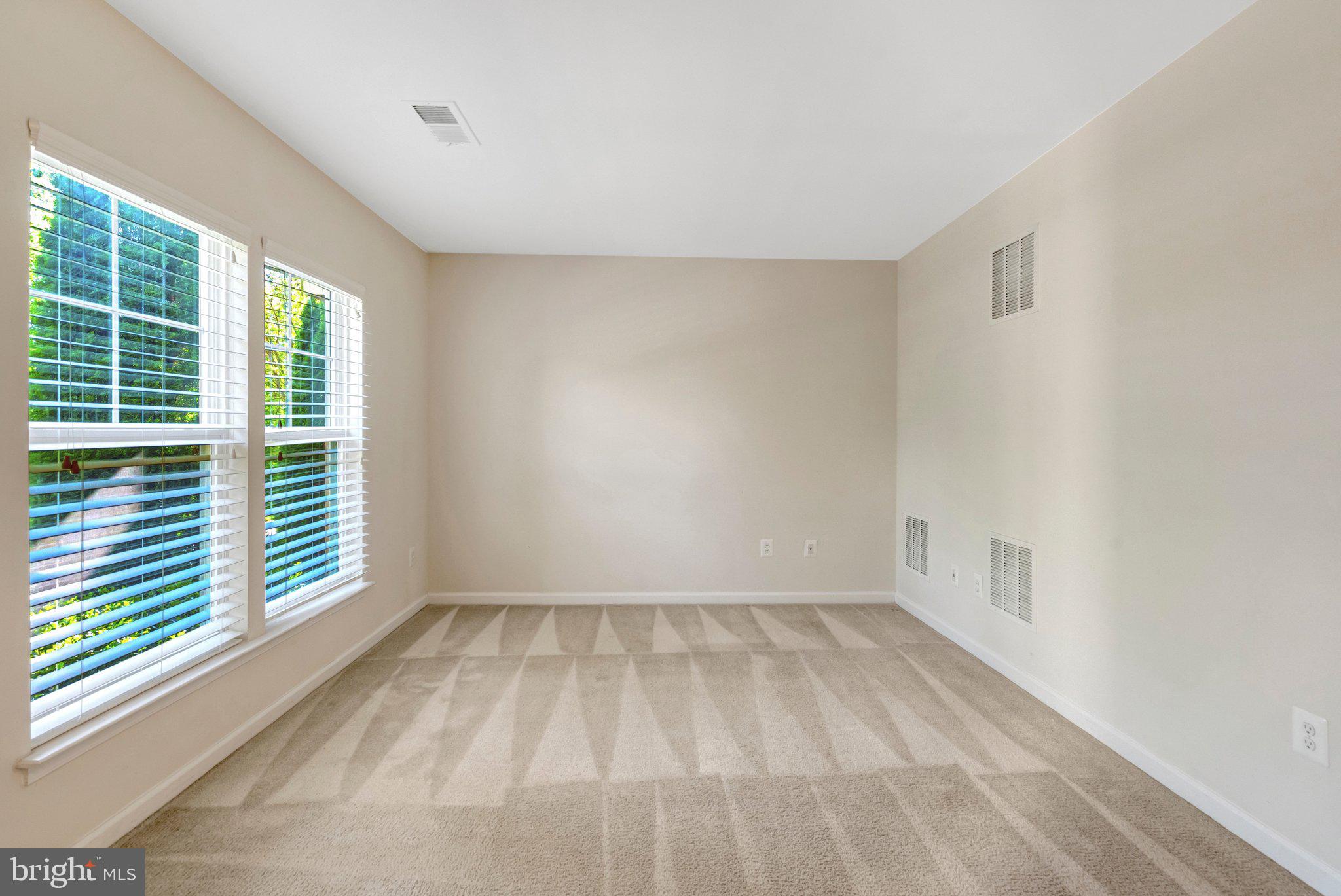 8932 Dahlgren Ridge Road Manassas, VA 20111 - Photo 5 of 41 a view of room with window and hardwood floor