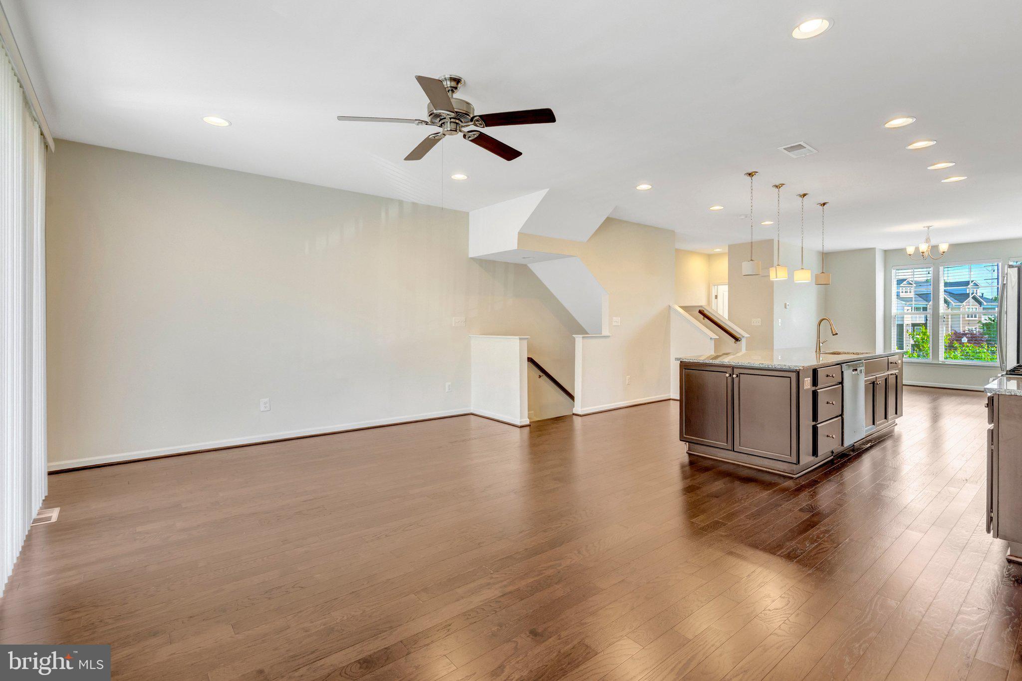 8932 Dahlgren Ridge Road Manassas, VA 20111 - Photo 9 of 41 a view of a room with wooden floor and staircase