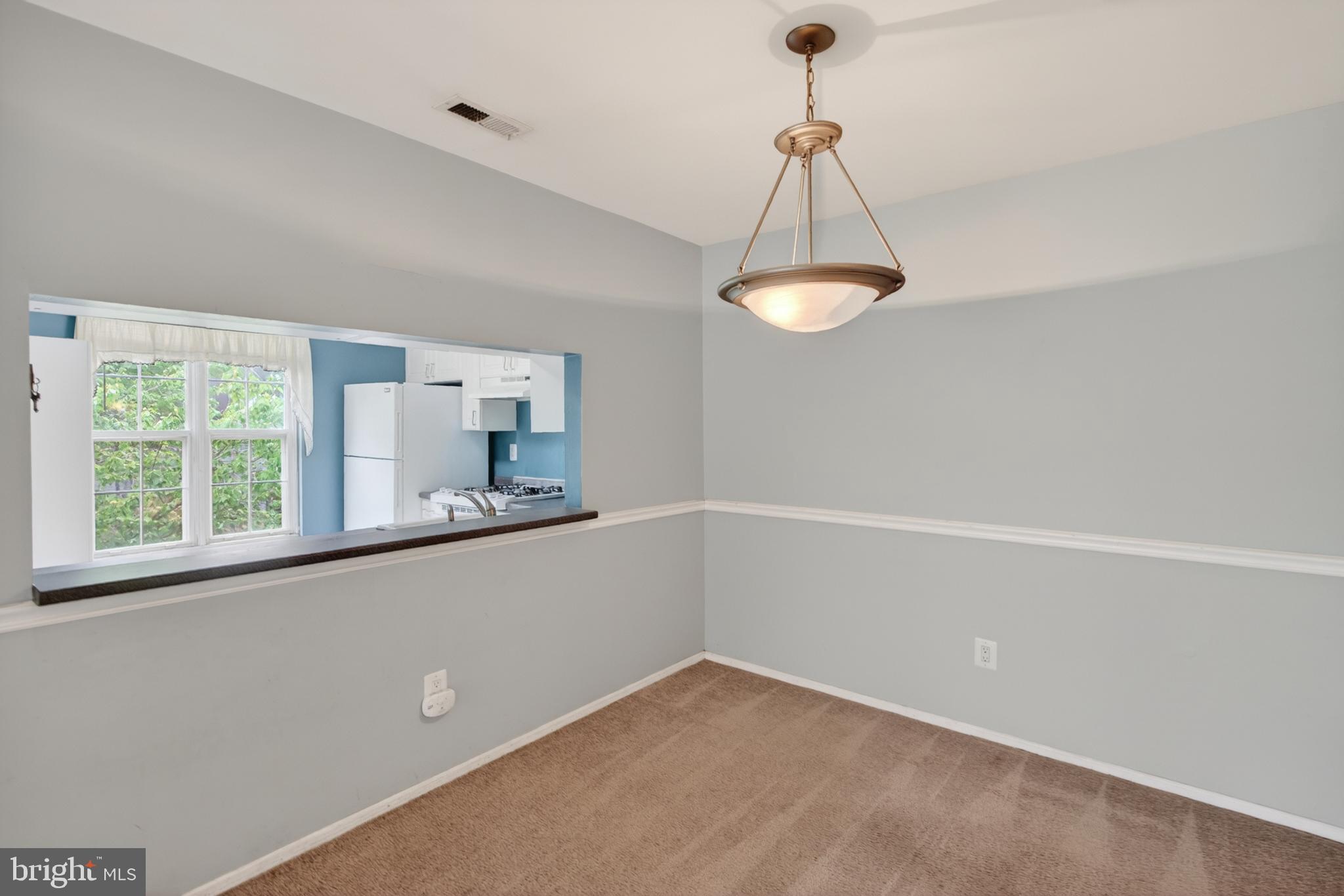 3302 B Ramsbury Court Mount Laurel, NJ 08054 - Photo 7 of 16 a view of a room with a chandelier fan and windows