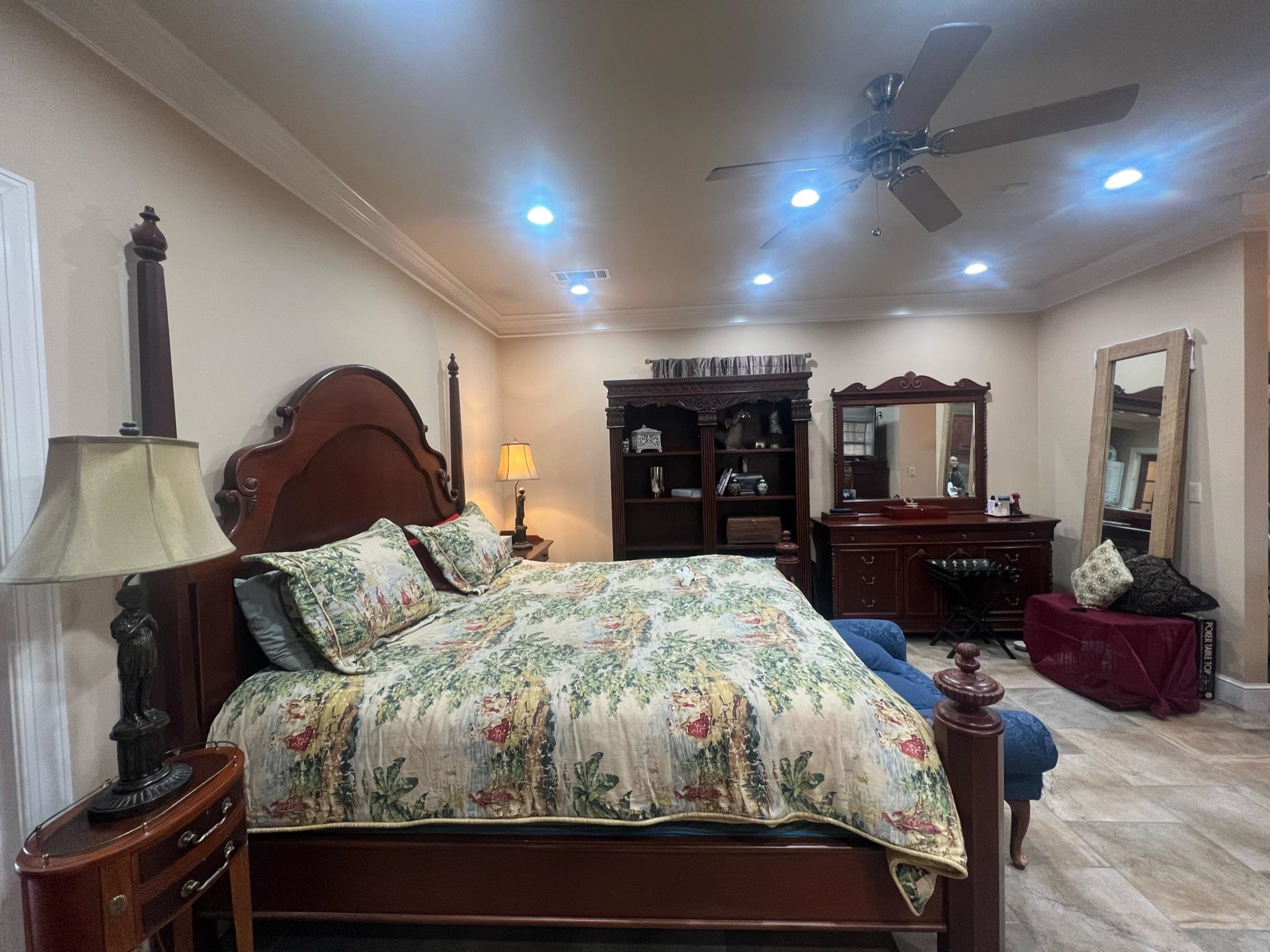 101 Peacock Holler Ripley, MS 38663 - Photo 19 of 25 a bedroom with a large bed and a couch