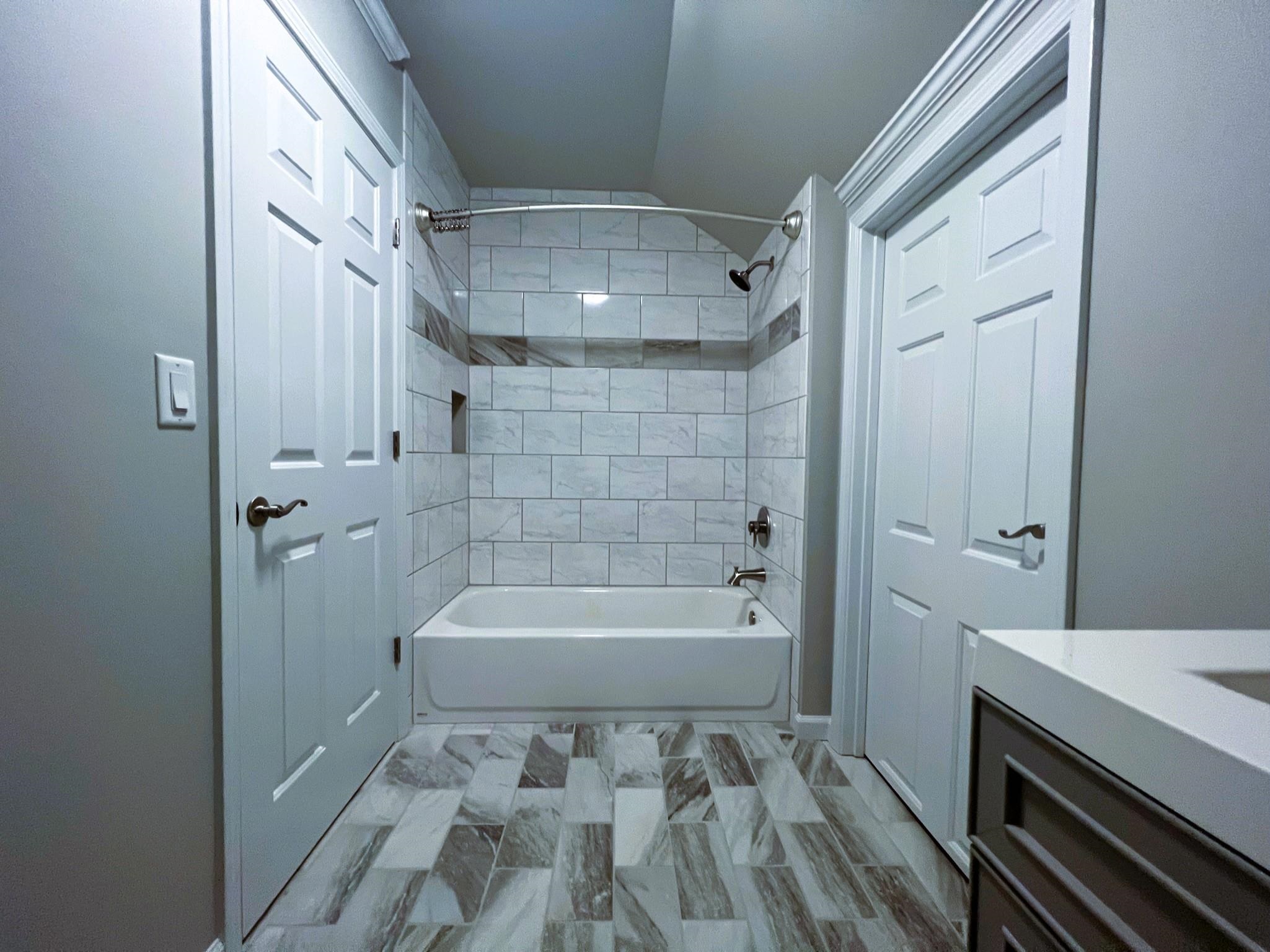 101 Peacock Holler Ripley, MS 38663 - Photo 23 of 25 a bathroom with a bathtub and shower