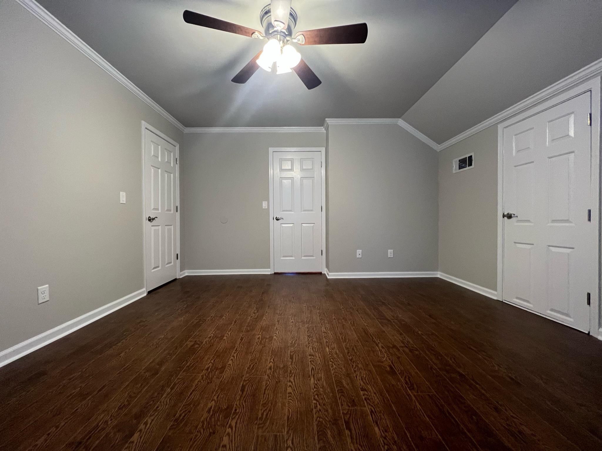 101 Peacock Holler Ripley, MS 38663 - Photo 25 of 25 a view of an empty room with wooden floor and a ceiling fan
