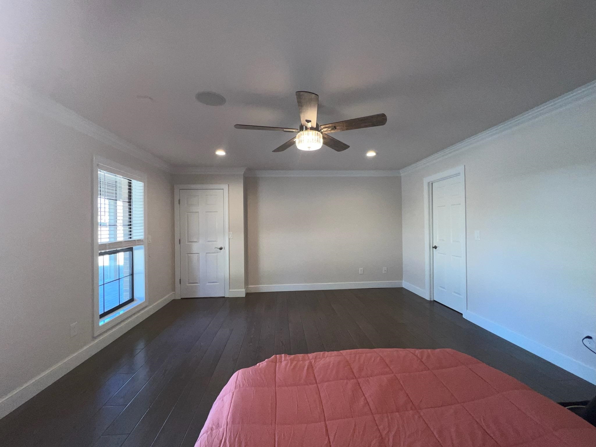 101 Peacock Holler Ripley, MS 38663 - Photo 9 of 25 a view of an empty room with a window and wooden floor