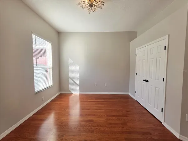 wooden floor with white walls