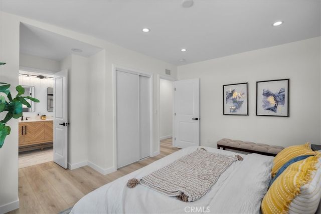 a bedroom with a bed and a couch