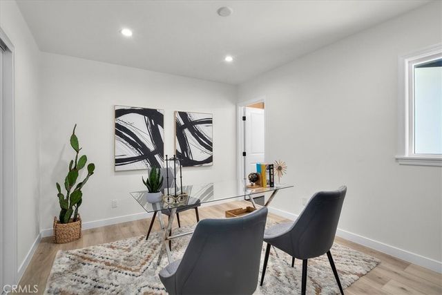 a workspace with furniture and a potted plant