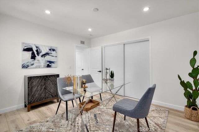 a view of a livingroom with furniture and a potted plant