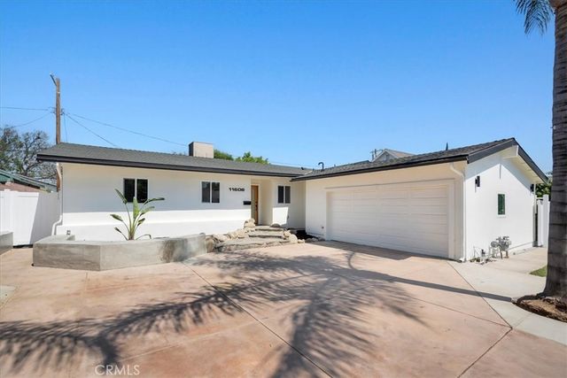a front view of a house with a outdoor space