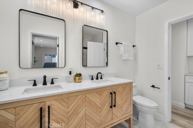 a bathroom with a glass shower door