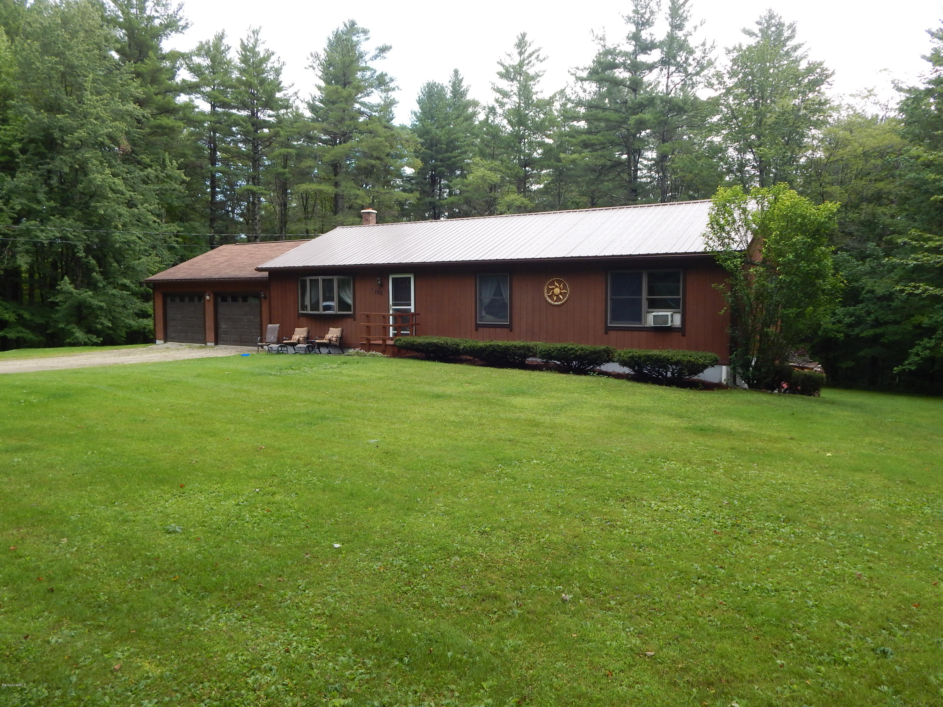 186 High St Hill Road Windsor, MA 01270 - Photo 1 of 29 a view of a house with a yard and sitting area