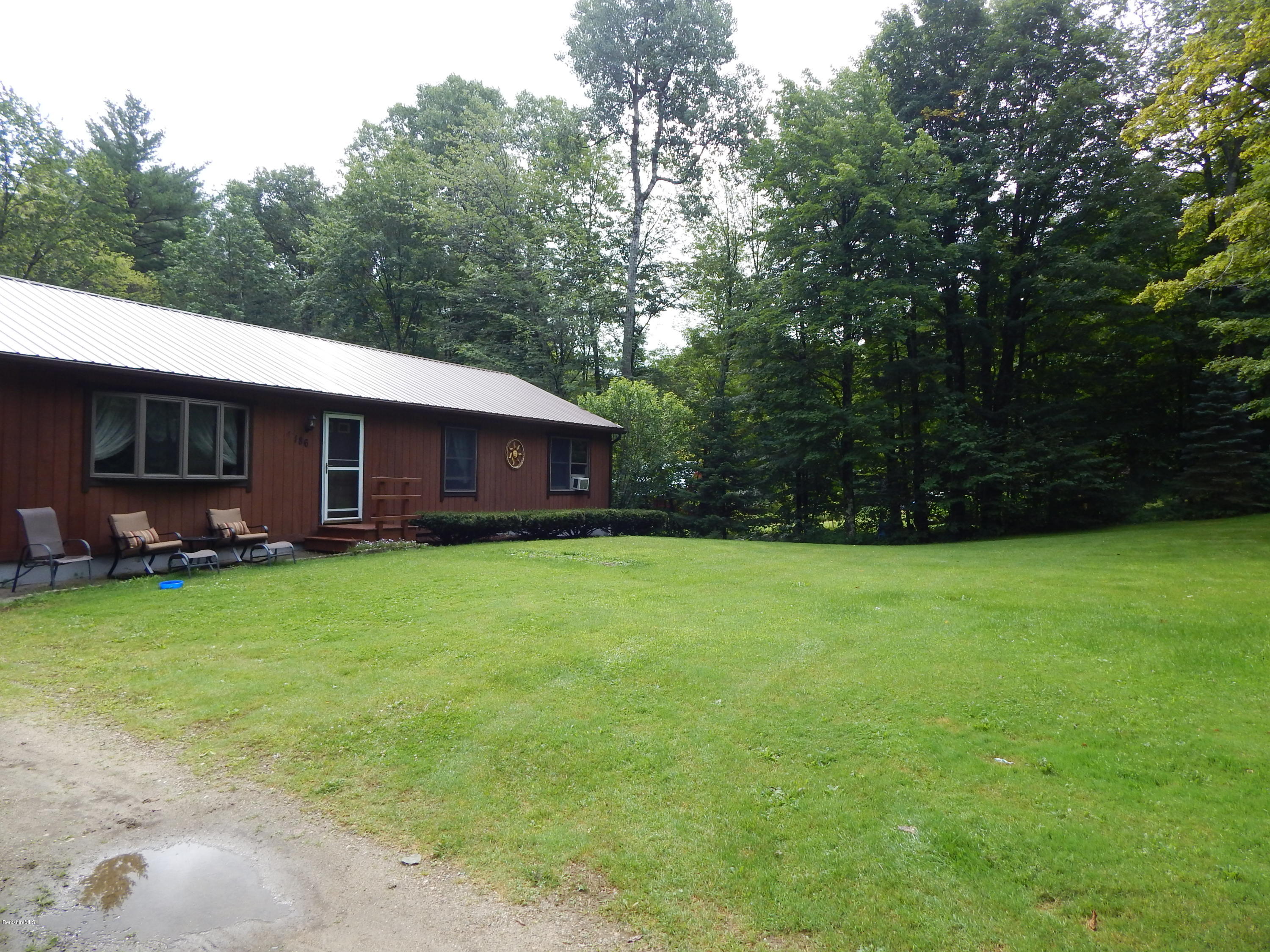 186 High St Hill Road Windsor, MA 01270 - Photo 2 of 29 a backyard of a house with lots of green space