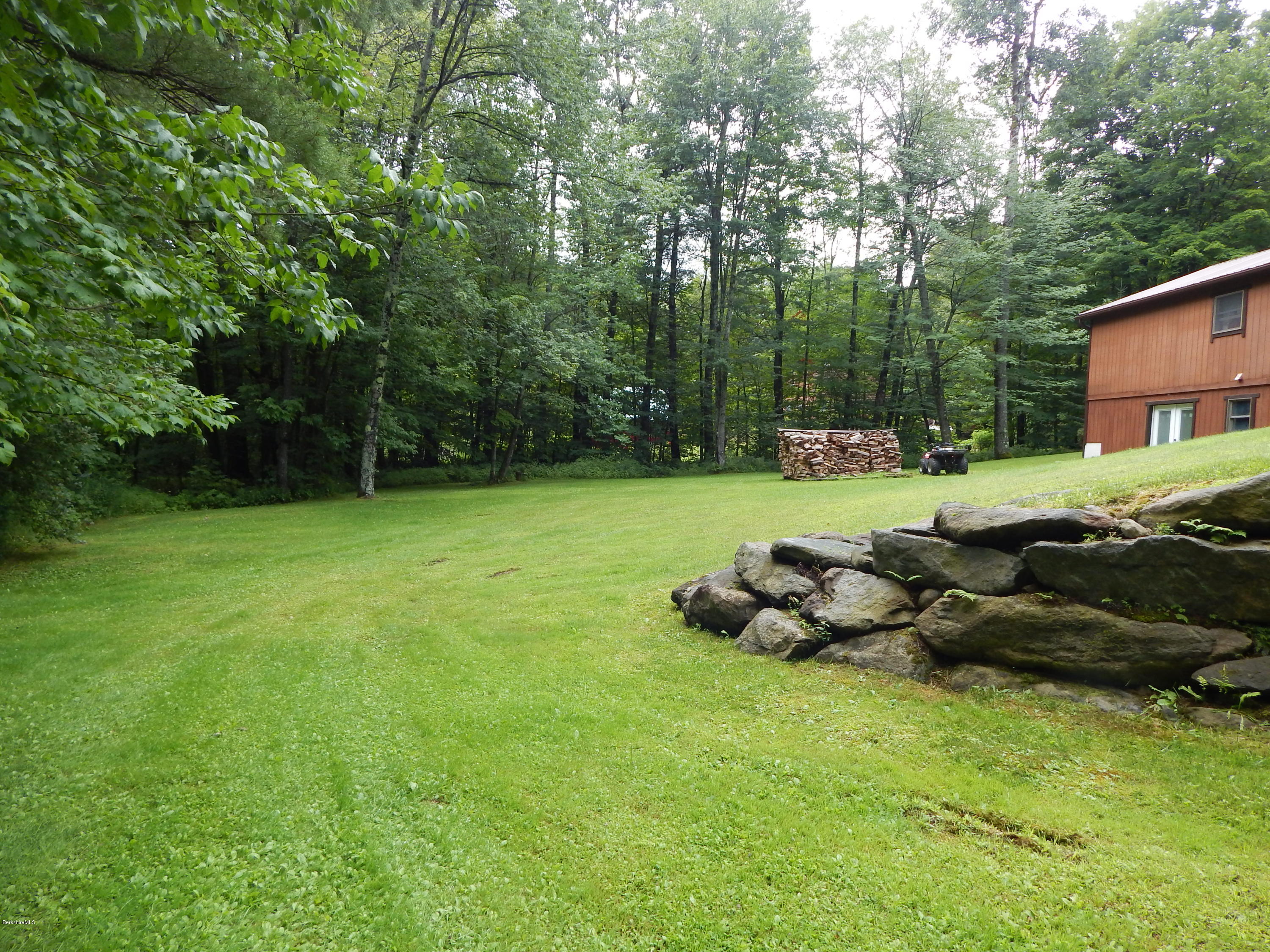 186 High St Hill Road Windsor, MA 01270 - Photo 3 of 29 a backyard of a house with lots of green space
