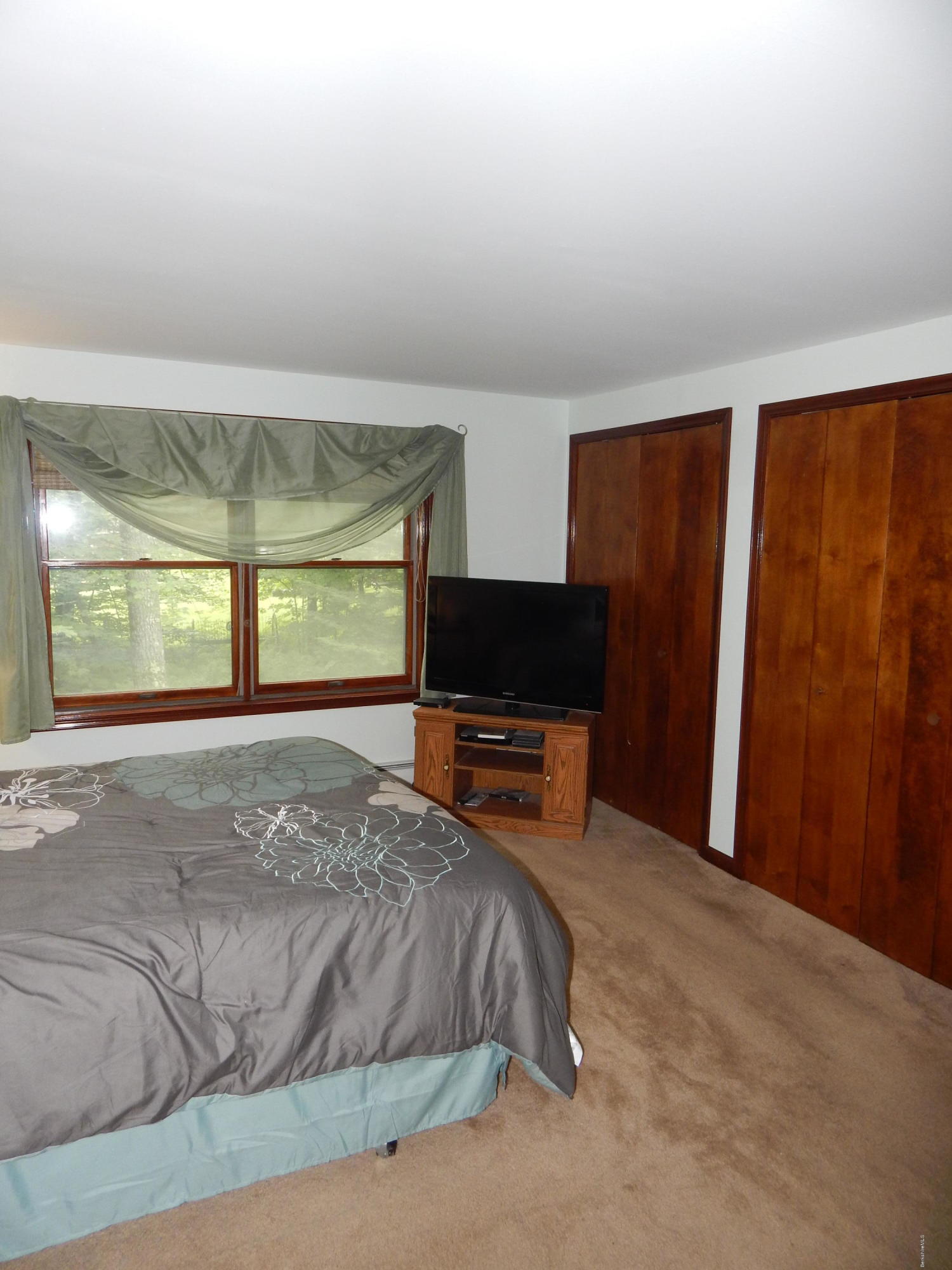 186 High St Hill Road Windsor, MA 01270 - Photo 22 of 29 a bedroom with a bed television and a window