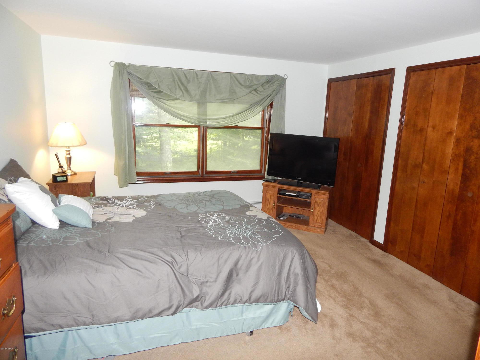 186 High St Hill Road Windsor, MA 01270 - Photo 23 of 29 a bedroom with a bed and a flat screen tv