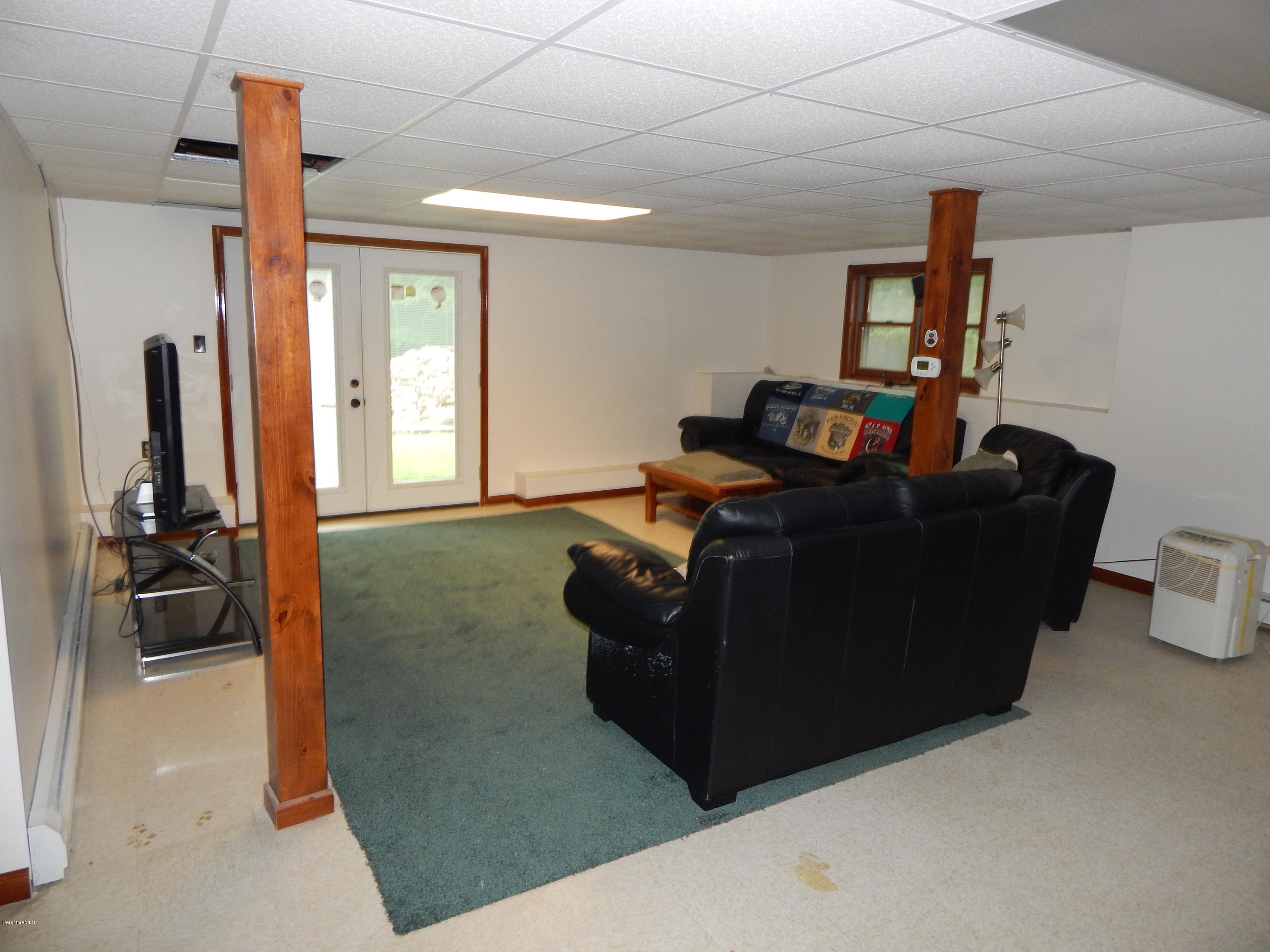 186 High St Hill Road Windsor, MA 01270 - Photo 27 of 29 a living room with furniture and a gym equipment
