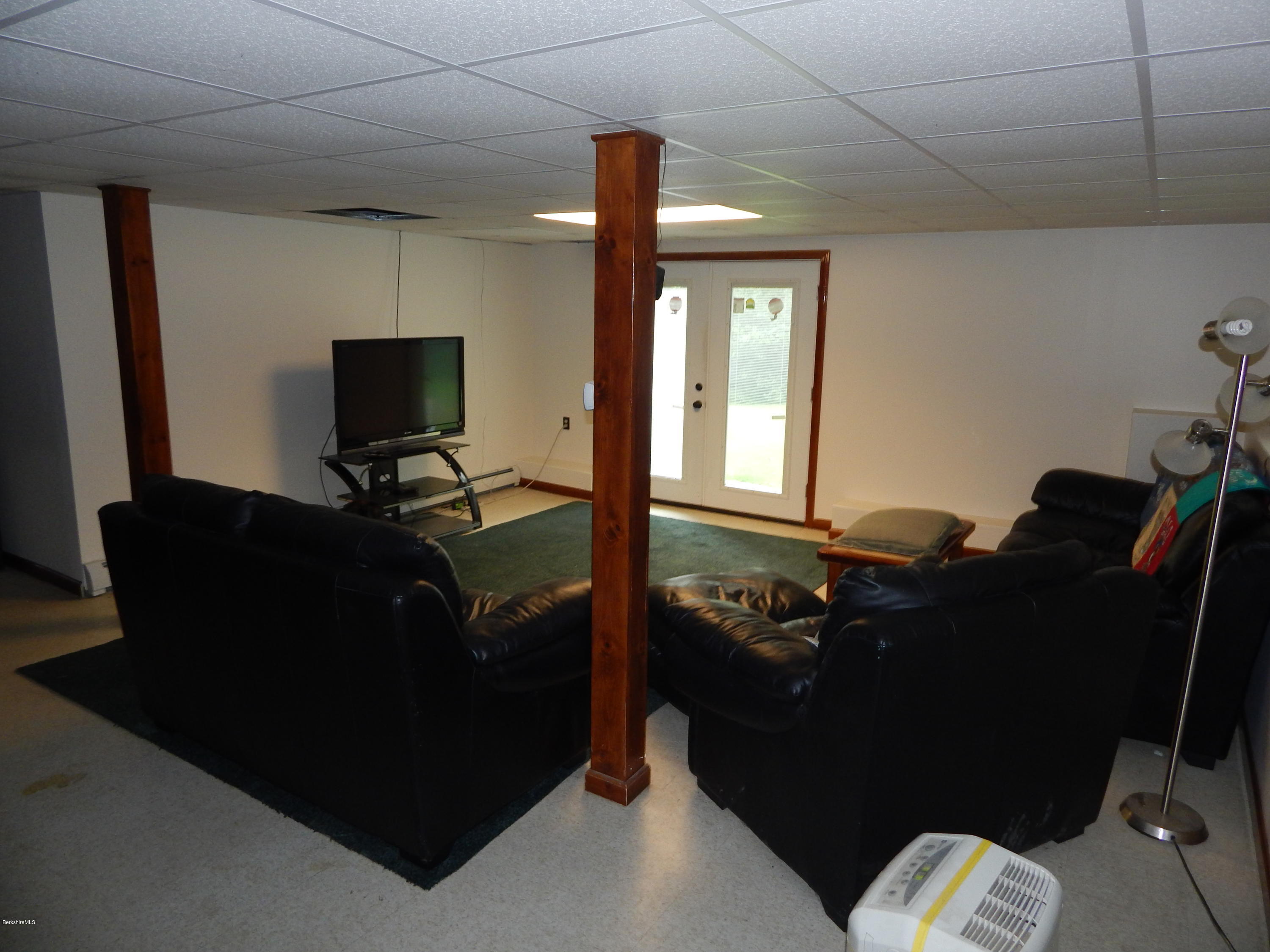 186 High St Hill Road Windsor, MA 01270 - Photo 29 of 29 a living room with furniture and a flat screen tv