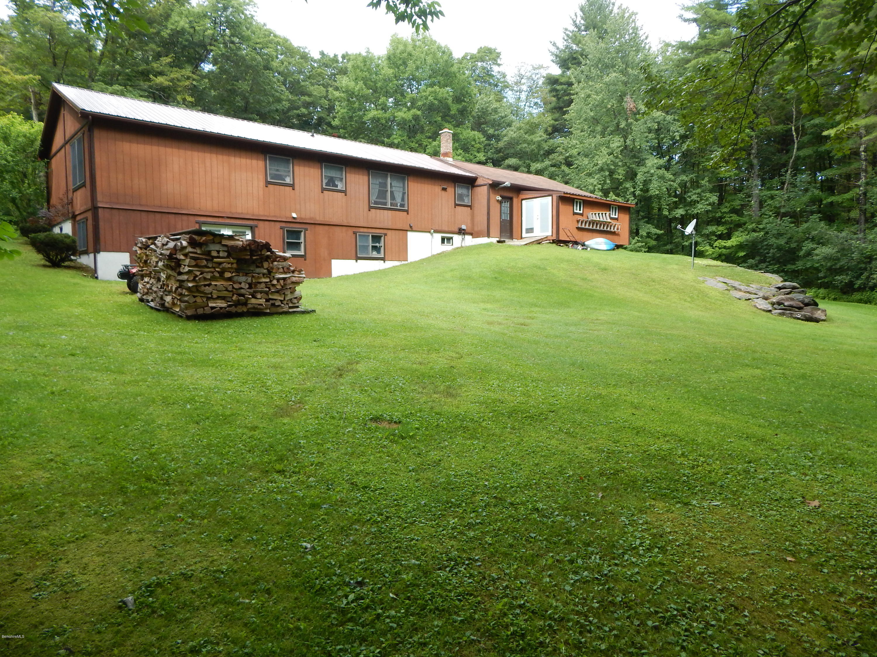 186 High St Hill Road Windsor, MA 01270 - Photo 5 of 29 a backyard of a house with lots of green space