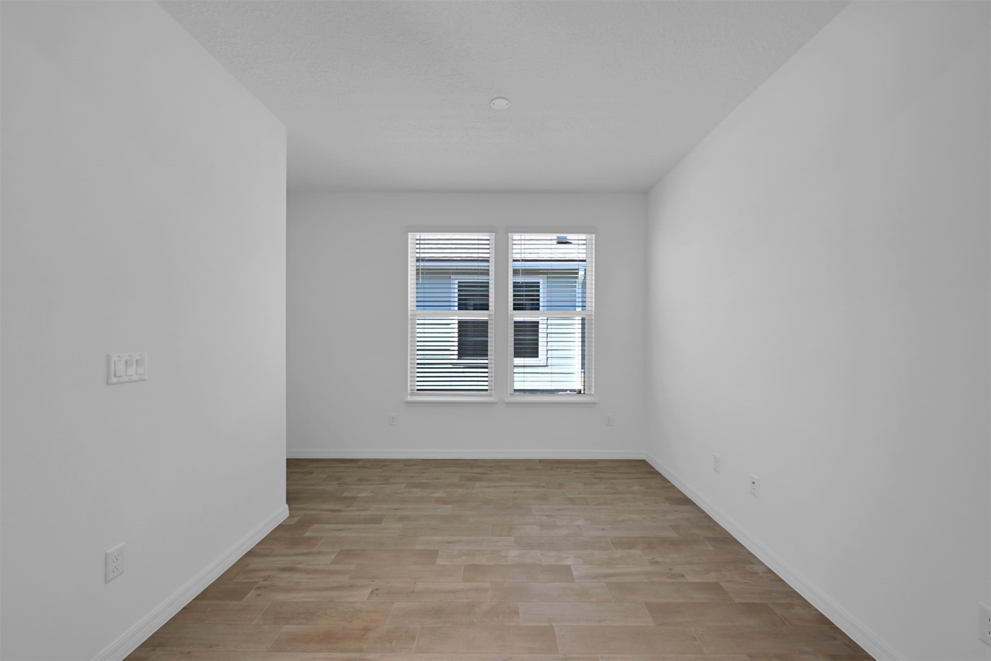285 Ecliptic Loop Yulee, FL 32097 - Photo 22 of 42 an empty room with a window