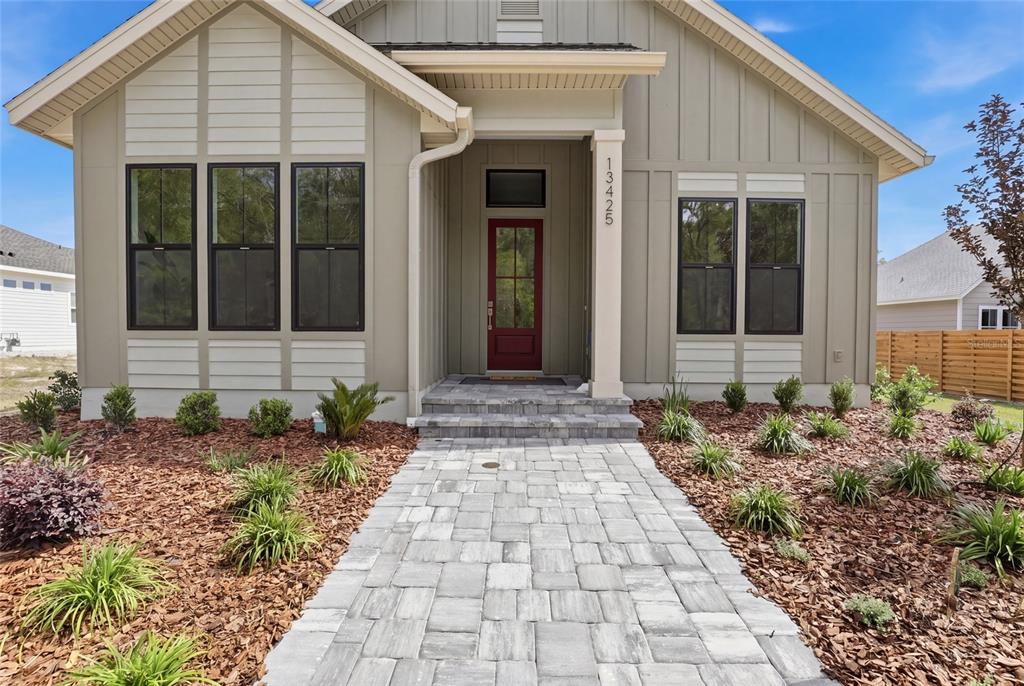 13425 Southwest 9th Road Newberry, FL 32669 - Photo 43 of 46 a front view of a house with garden