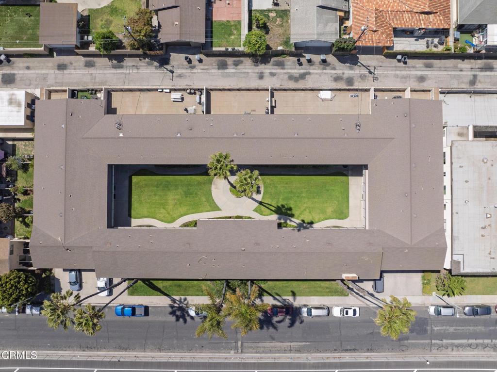 560 West Gonzales Road Oxnard, CA 93036 - Photo 8 of 13 a aerial view of a house with a yard and potted plants