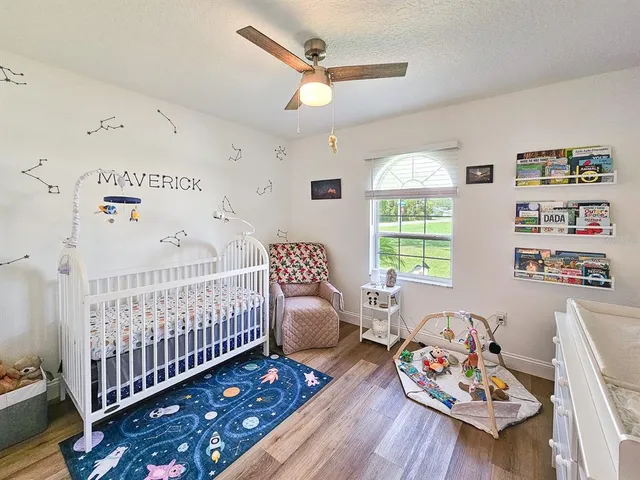 a bedroom with furniture and a window