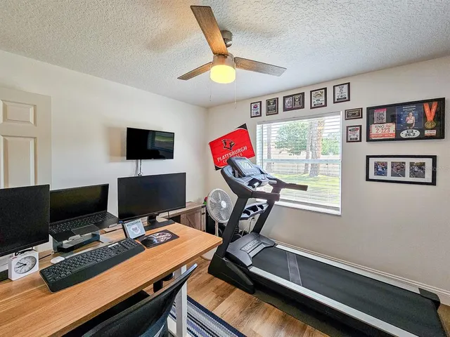 a workspace with furniture and screen