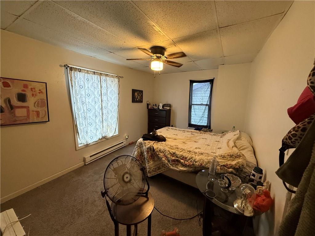 320 West Birch Street Butler, PA 16001 - Photo 19 of 23 a bedroom with a bed and a chandelier