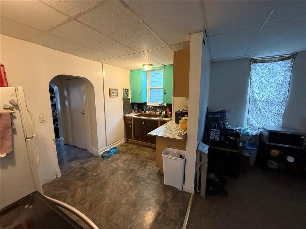320 West Birch Street Butler, PA 16001 - Photo 23 of 23 a kitchen with a refrigerator and a stove