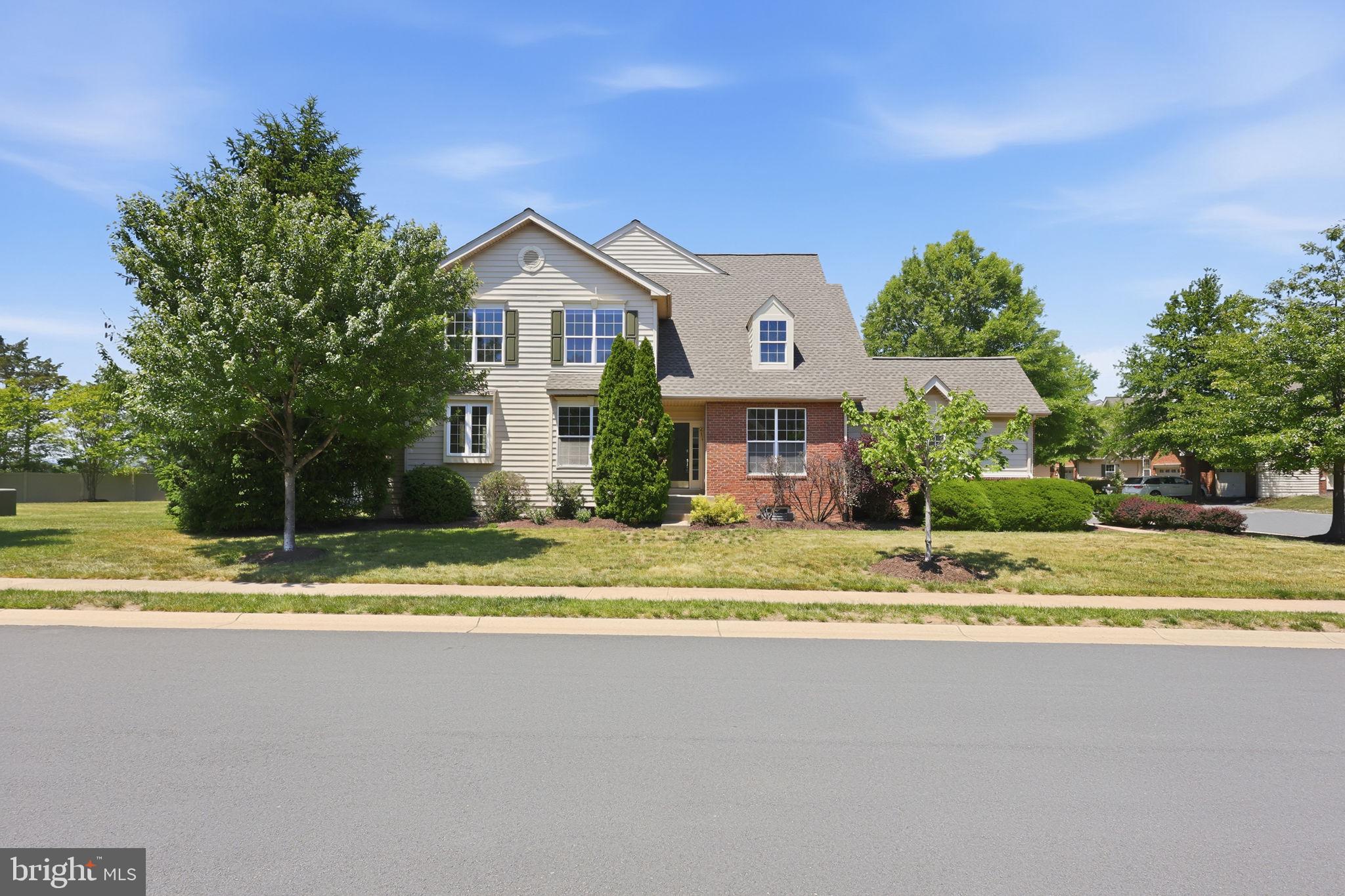19617 Edgemont Square Ashburn, VA 20147 - Photo 65 of 65 a view of a house with a swimming pool and a yard