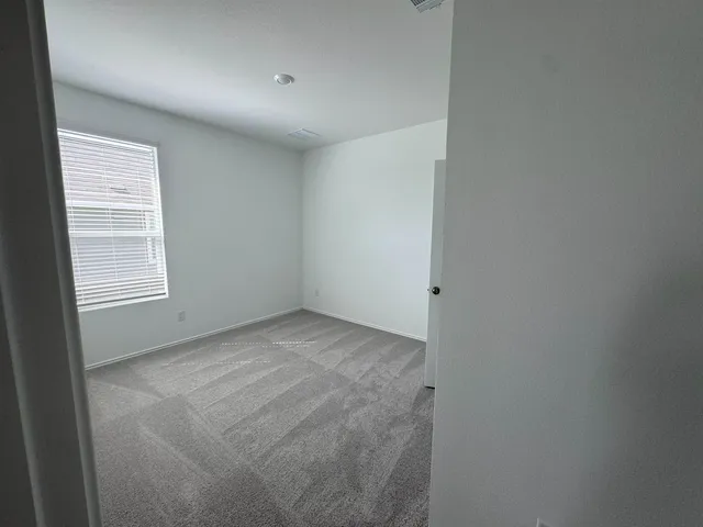 a view of empty room with windows