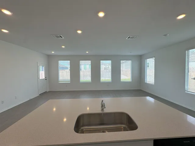 a kitchen with a sink and a window