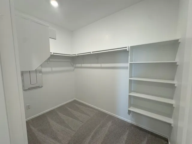 a view of an empty walk in closet