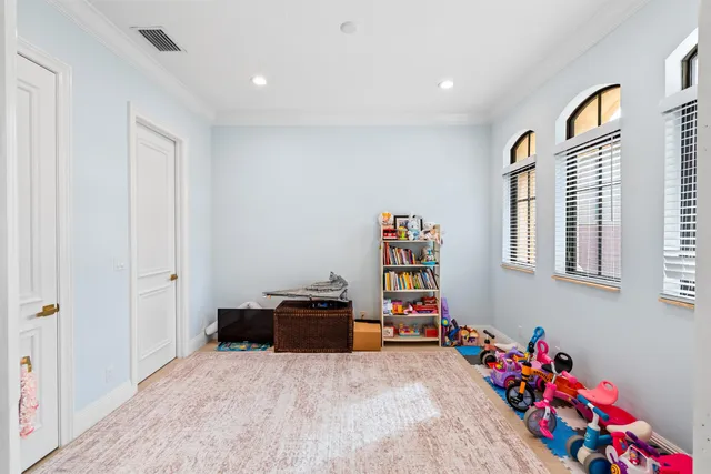 a children room with toys and a window