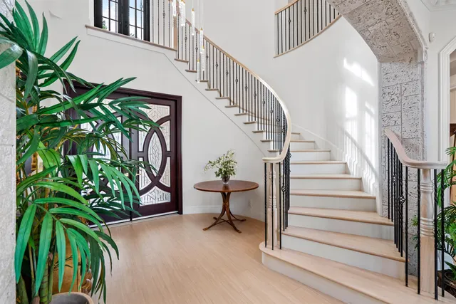 a view of entryway with wooden floor and a potted plant
