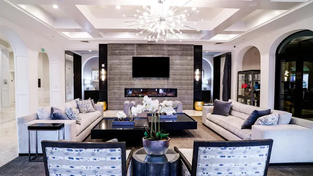 a living room with fireplace furniture and a flat screen tv
