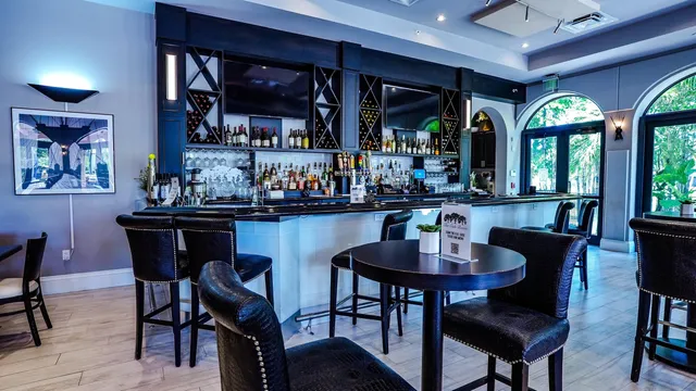 a dining room with furniture and window