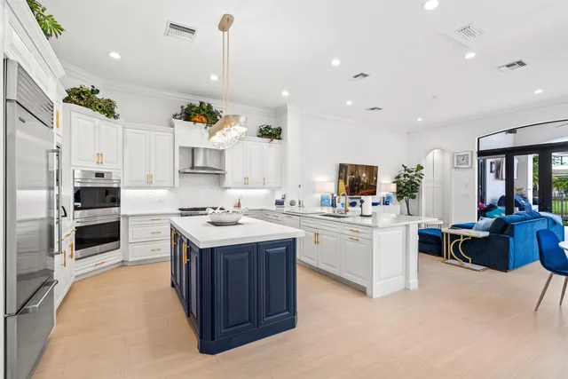a kitchen with a sink stove and refrigerator